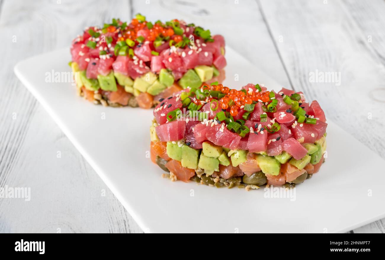 Tuna and salmon tartare on the serving plate Stock Photo