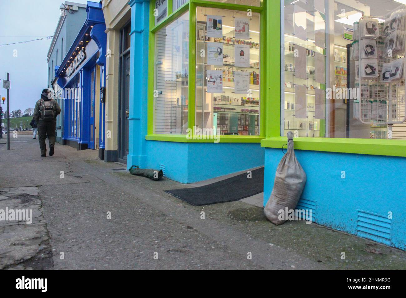 Bantry, West Cork, Ireland. 17th Feb, 2022.  Storm Eunice will approach Ireland with possible coastal flooding. Bantry town is preparing for possible flooding. Pictured below is business owner Steven O'Donovan placing flood barriers at his premises. Credit: Karlis Dzjamko/Alamy Live News Stock Photo
