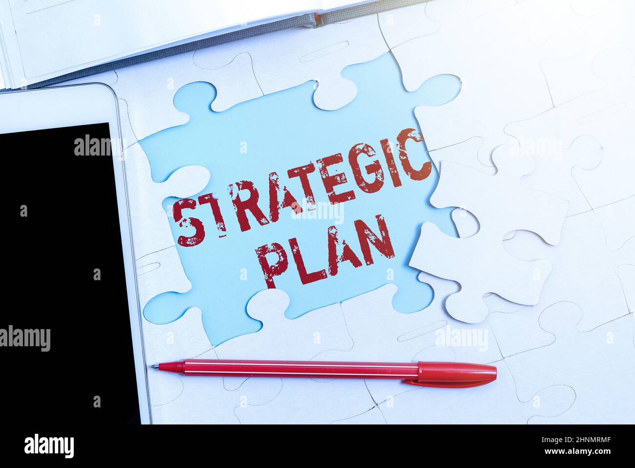 Sign displaying Strategic Plan, Word Written on A process of defining