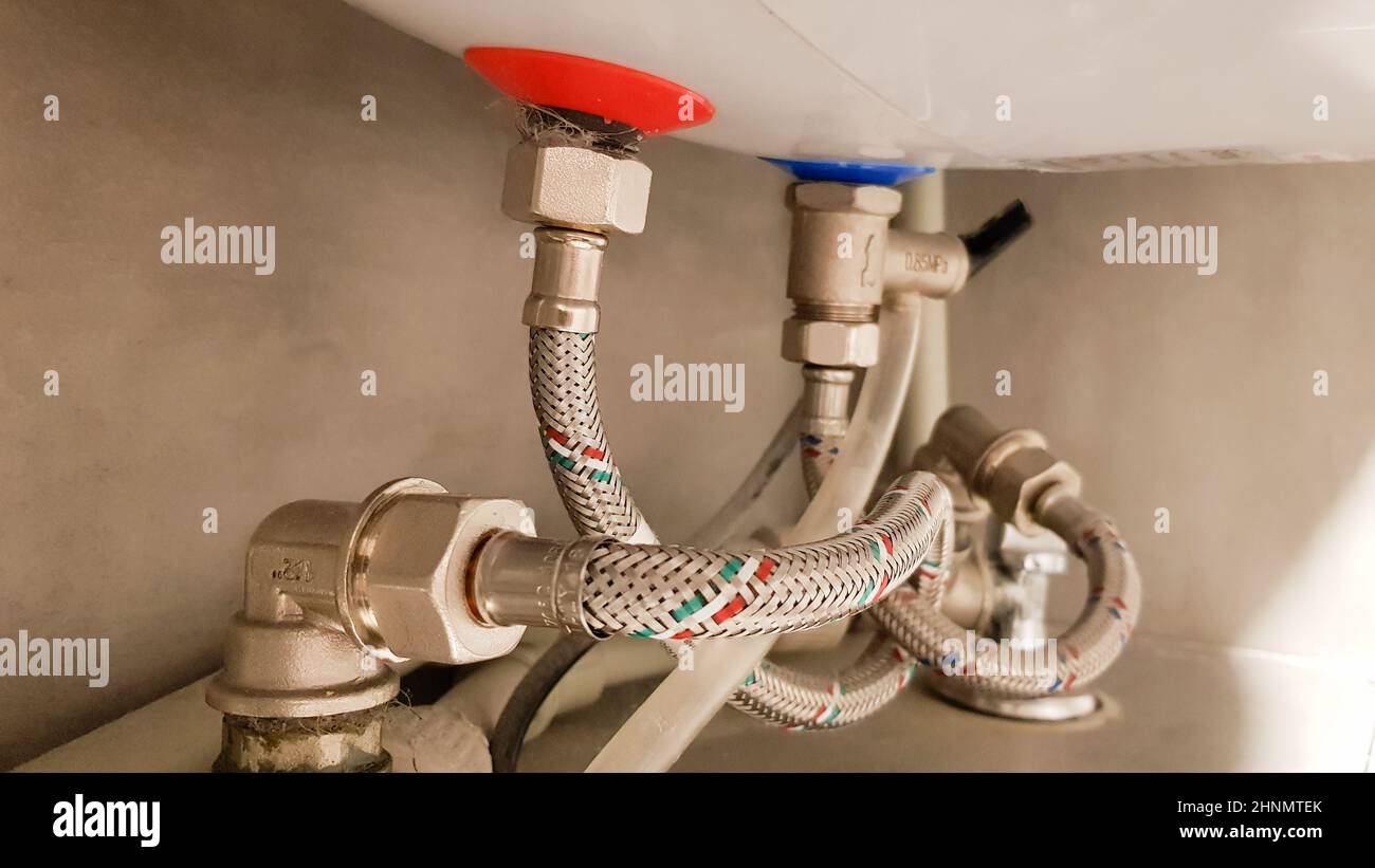 Connection of water supply, hot and cold water to the boiler. Hose for