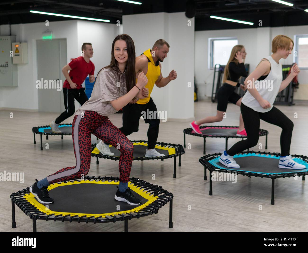 Women's and men's group on a sports trampoline, fitness training, healthy  life - a concept trampoline group batut workout men, for lifestyle athletic  Stock Photo - Alamy