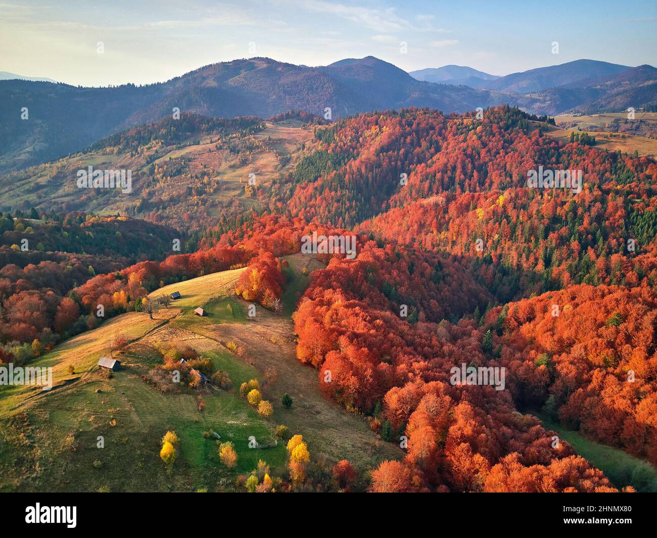 Beautiful mountain autumn landscape with meadow and colorful forest ...