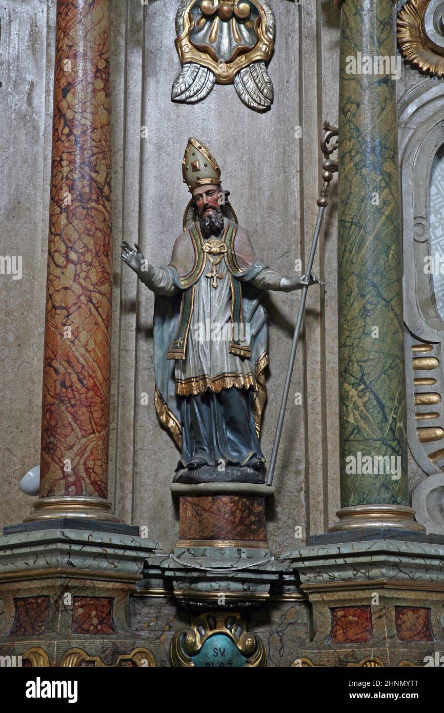 St. Blaise, statue on the altar of St. Anthony of Padua in the Franciscan Church of St. Peter in Cernik, Croatia Stock Photo