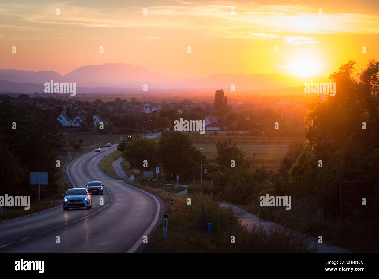 traffic on asphalt road or highway route at sunset time Stock Photo