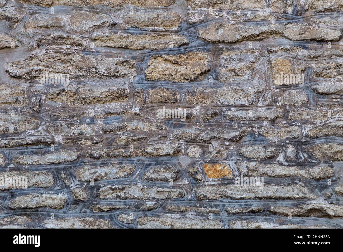 Background from a historic stone wall. Stock Photo