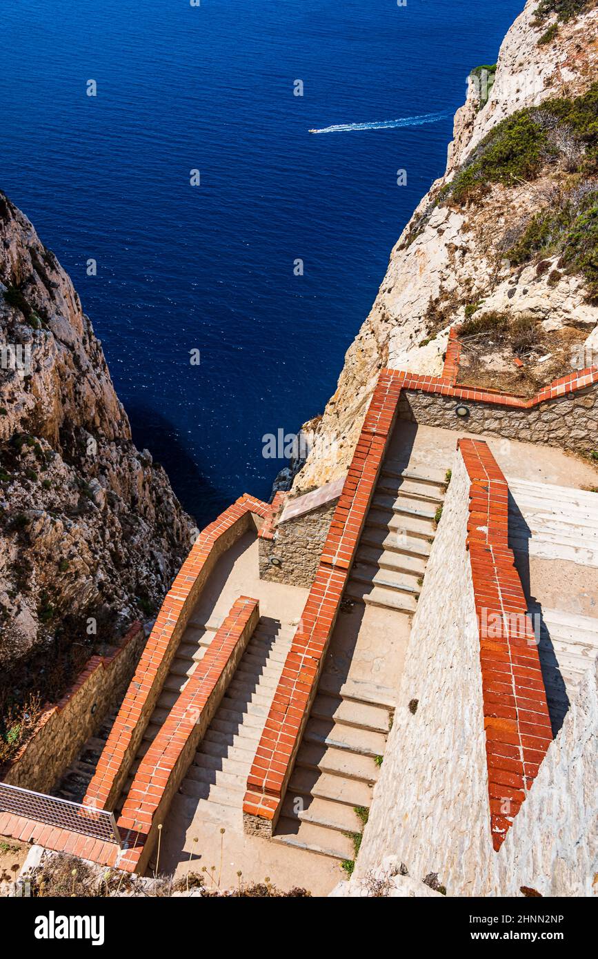 A stairway cut into the cliff in 1954, the 654-step escala del cabirol (goat's steps), leads from a car park at the top of the cliff down to the entra Stock Photo