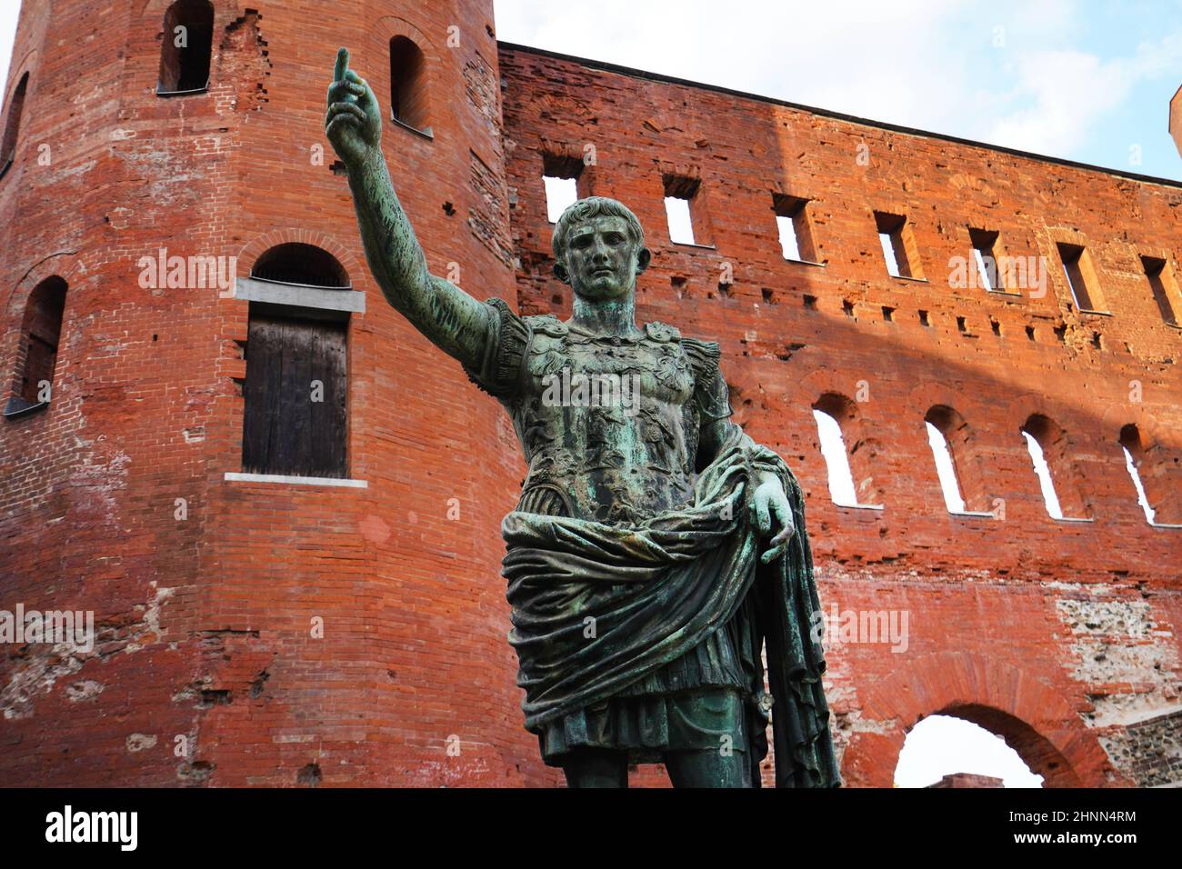Caesar Augustus bronze statue in front of Palatine Gate in Turin, Italy Stock Photo
