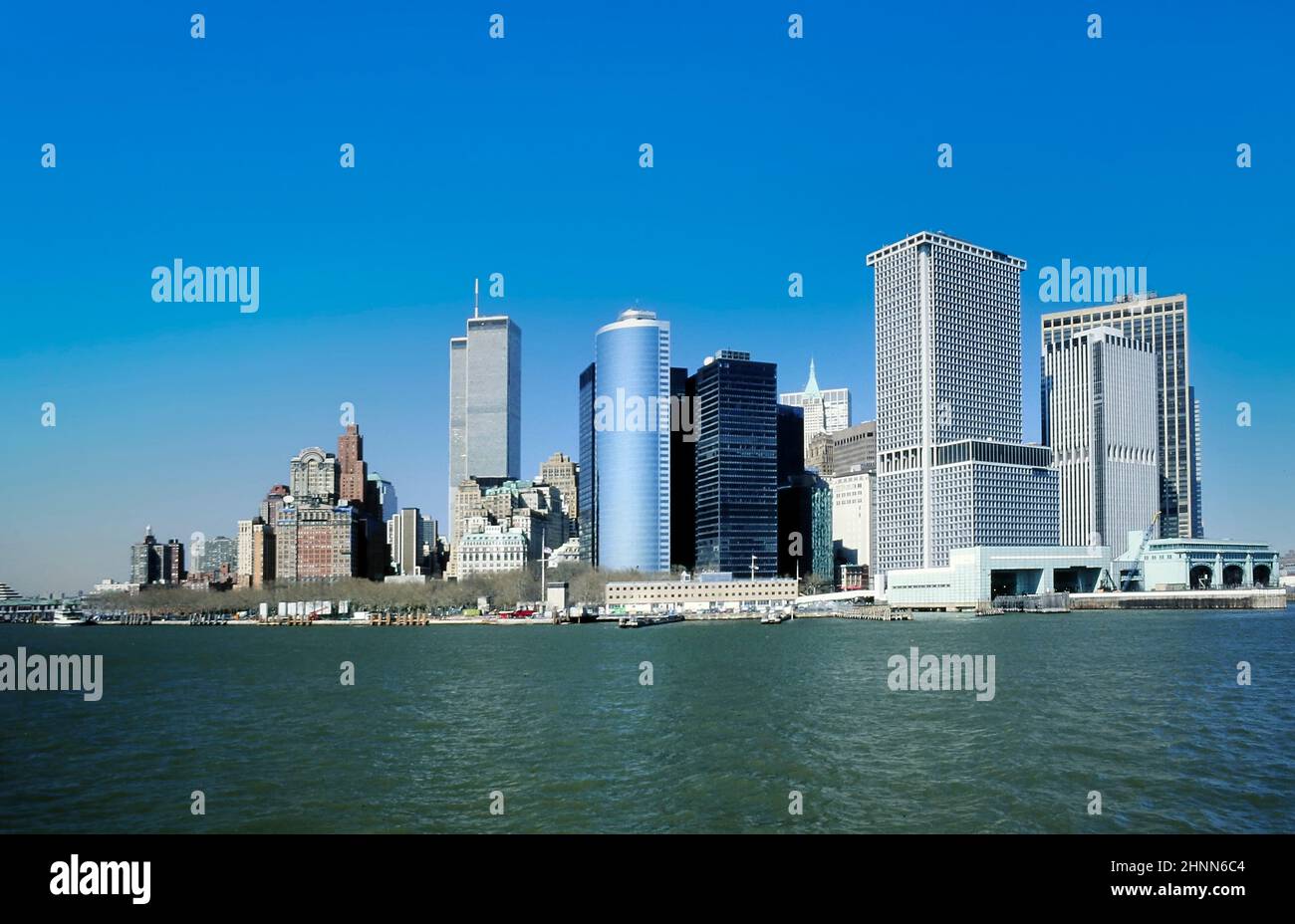 view to downtown Manhattan with skyline and World trade center under clear blue sky Stock Photo