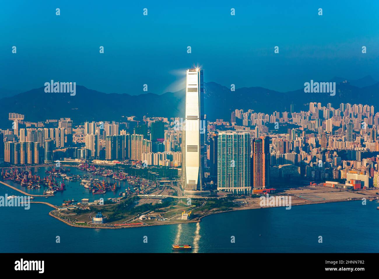 Hong Kong view from Victoria Peak to the bay and the skyscraper International Commerce Centre in spectacular sunset Stock Photo