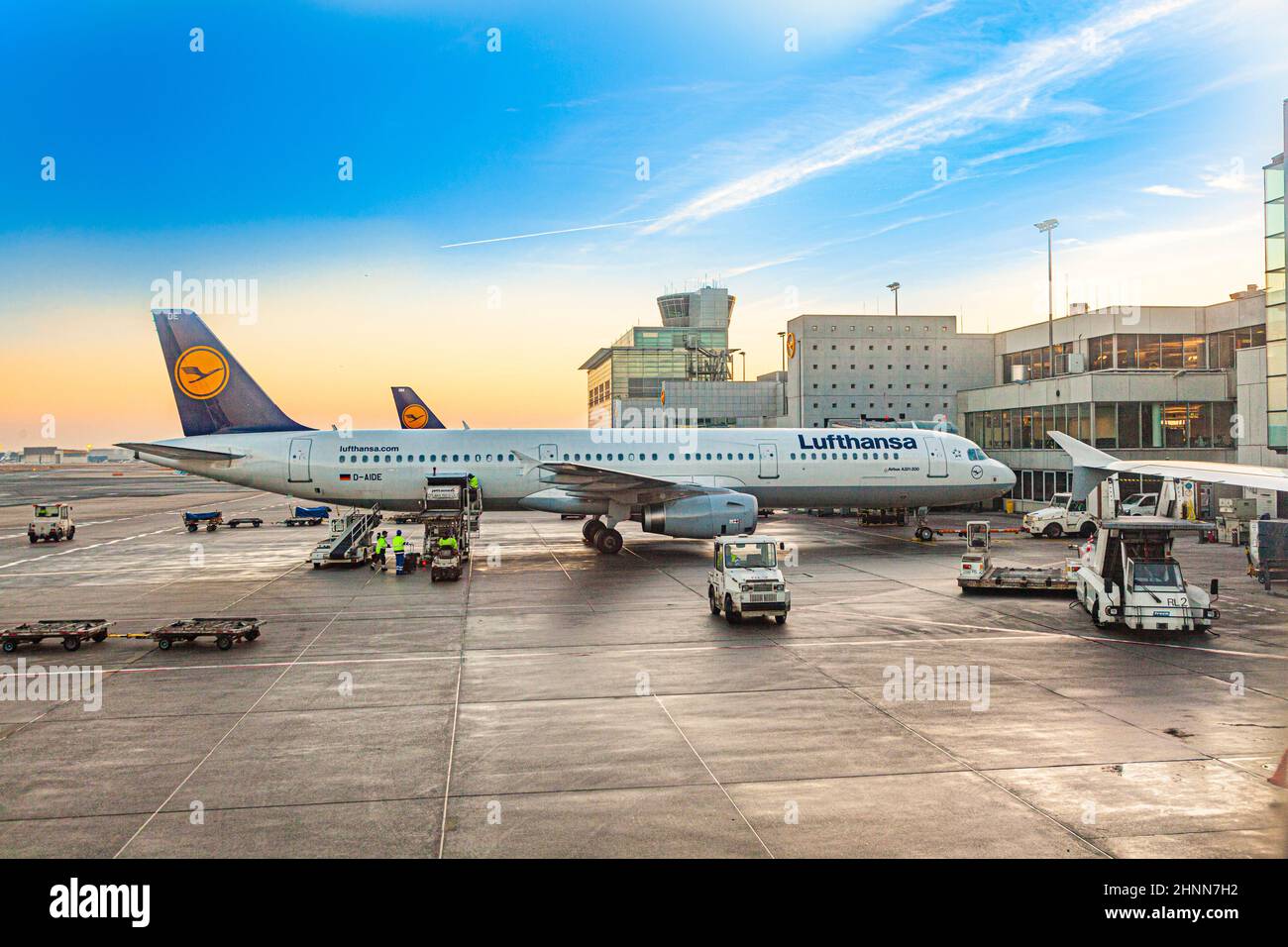 terminal 2 in sunset with Lufthansa aircraft at gate.  Frankfurt is one of the busiest airport in Europe with 59 million passengers in 2011. Stock Photo