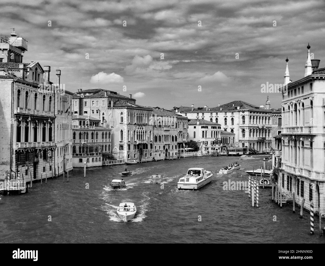 people enjoy visiting the grand canal  in Venice Stock Photo