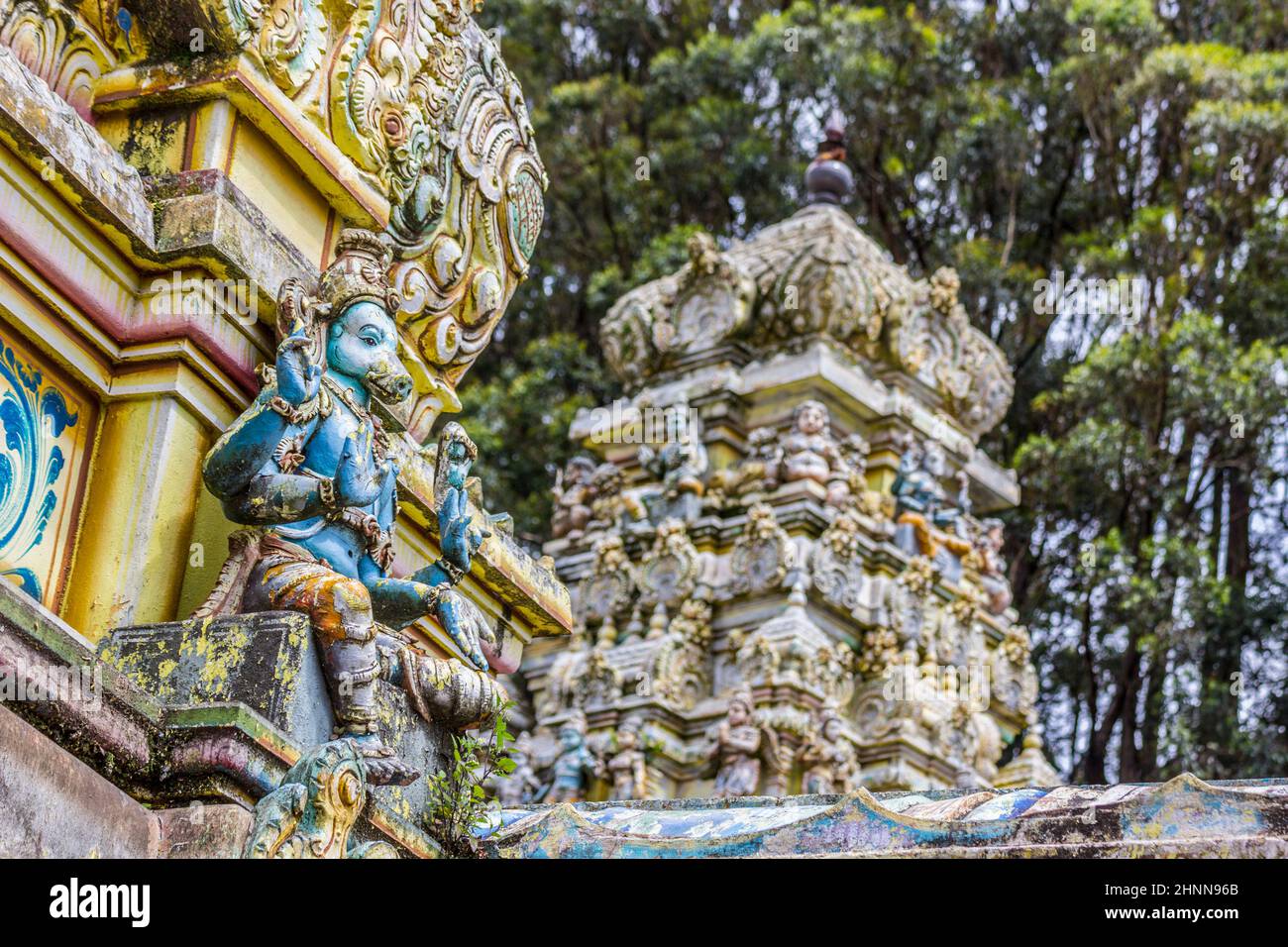 The Rising Gopuram Or Pinnacle of the Sita Hindu Temple Among the Foliage at Sita Eliya Among the Central Hills of Nuwara Eliya Stock Photo