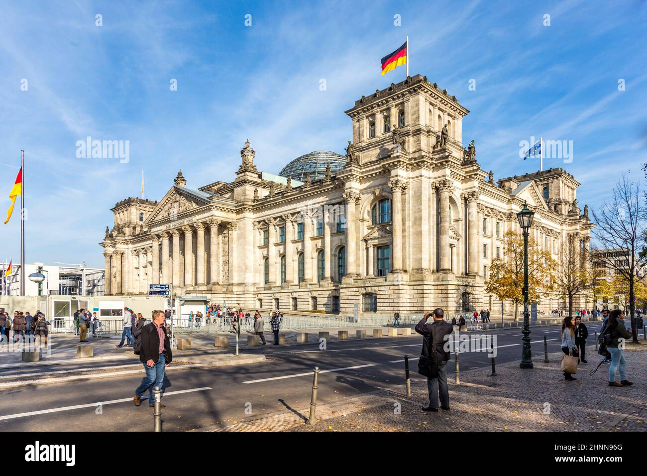 Tourists walk along Reichstag area in Berlin, Germany Stock Photo
