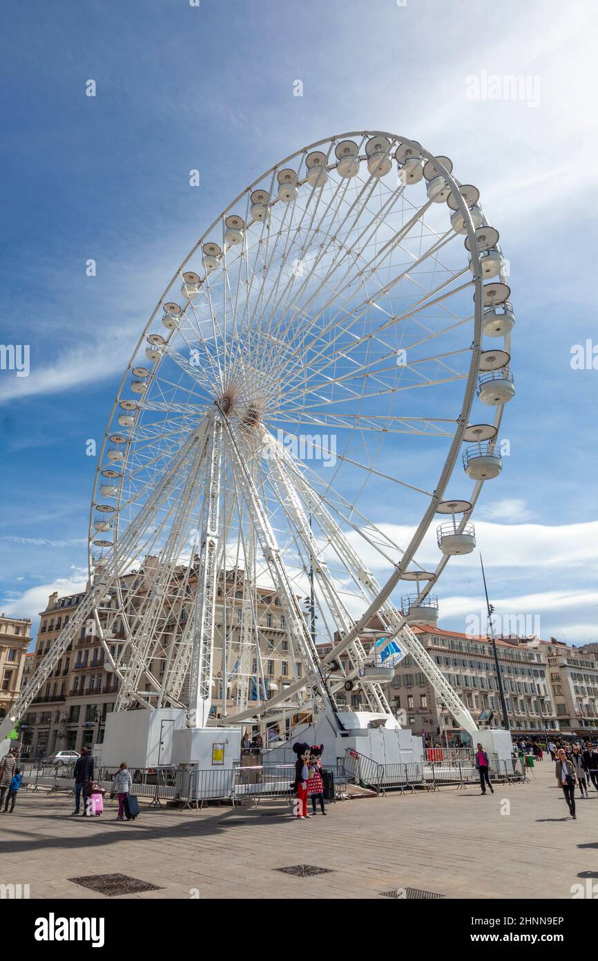 big wheel offers spectacular views to the harbor area and the old town of Marseille Stock Photo