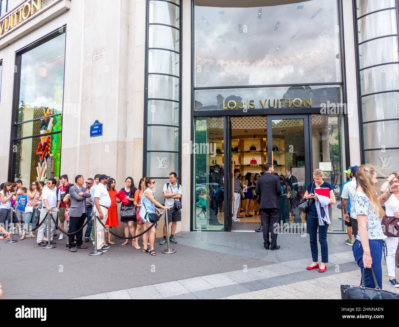 people walking and visiting the famous street in Paris, the Champs d´elysees in the heart of Paris.and queue up properly Stock Photo