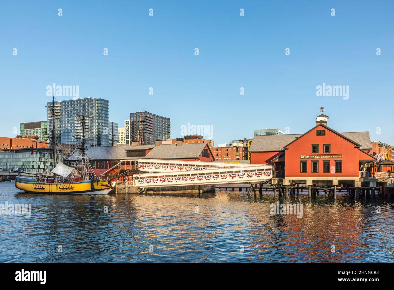pier with historic building of the harbor site where the Boston tea party took place. in 1773 Stock Photo