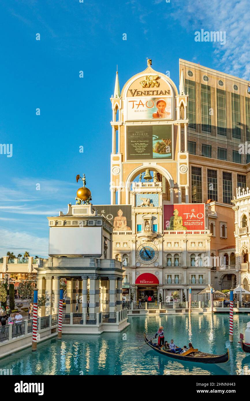 tourists enjoy gondola ride at the hotel and casino in Las