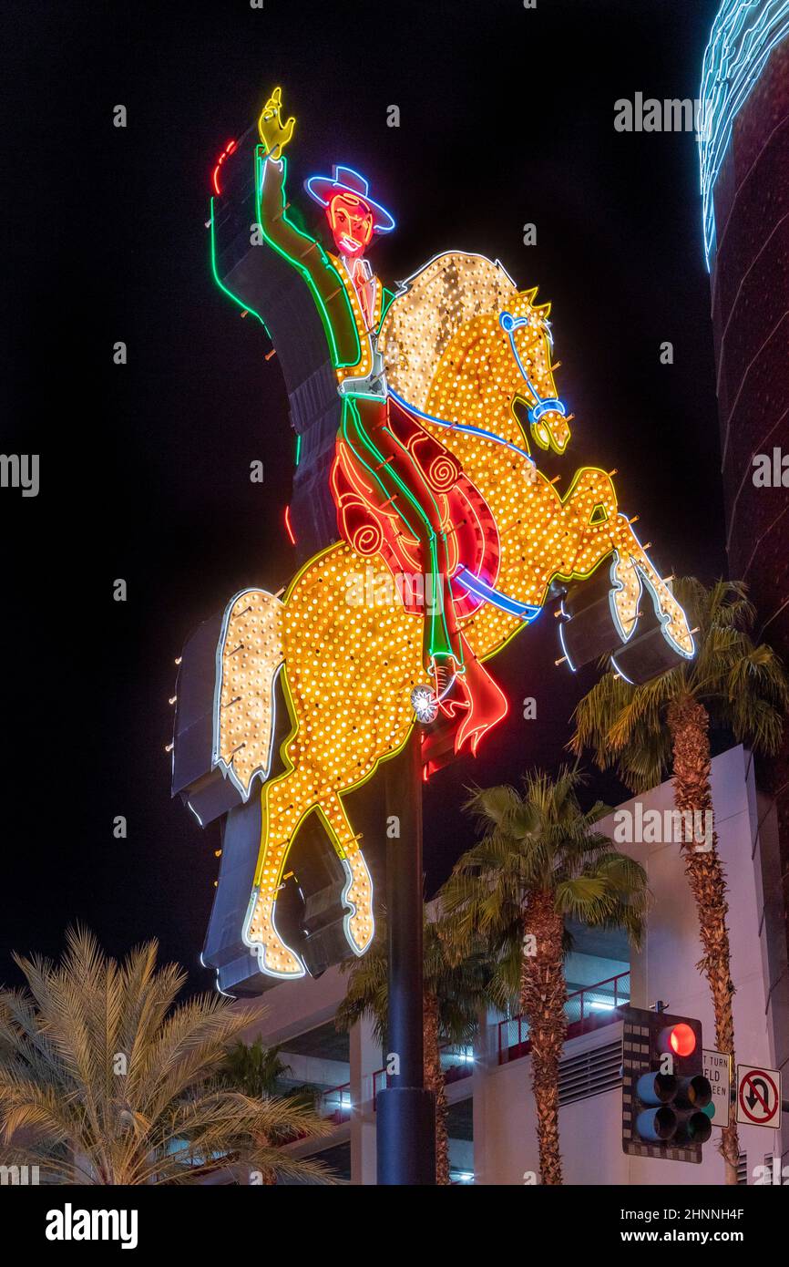 famous Fremont Street Hacienda Horse and Rider sign glows brightly after a full restorationin Las Vegas, Nevada Stock Photo