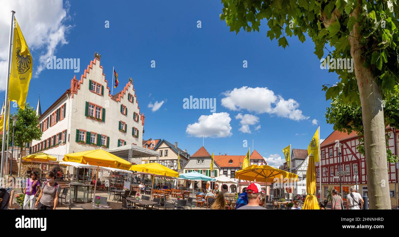 people enjoy a summer day at Market Place of Oppenheim, Germany during the corona season. Stock Photo