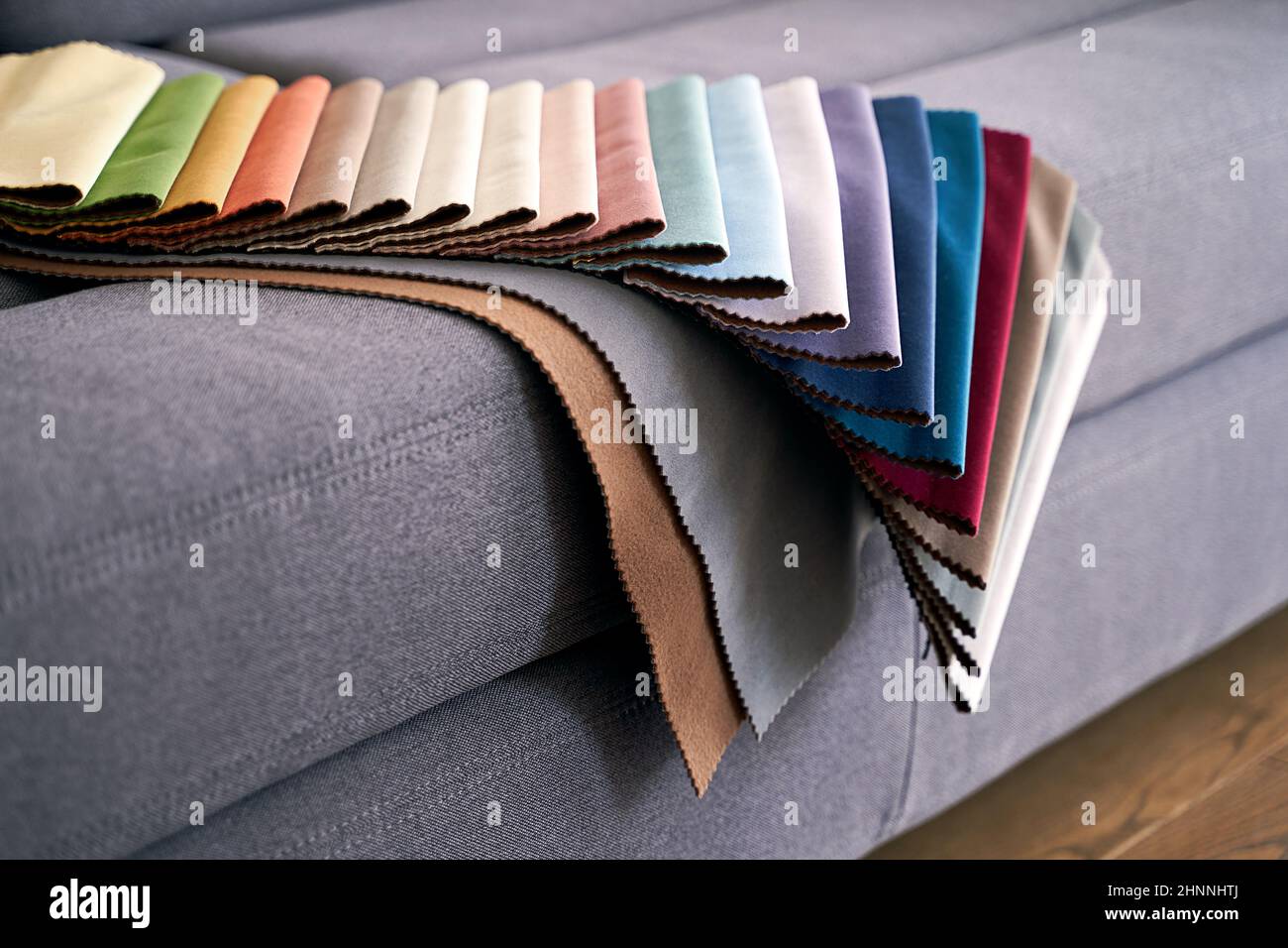 Colorful upholstery fabric samples on the home sofa Stock Photo Alamy