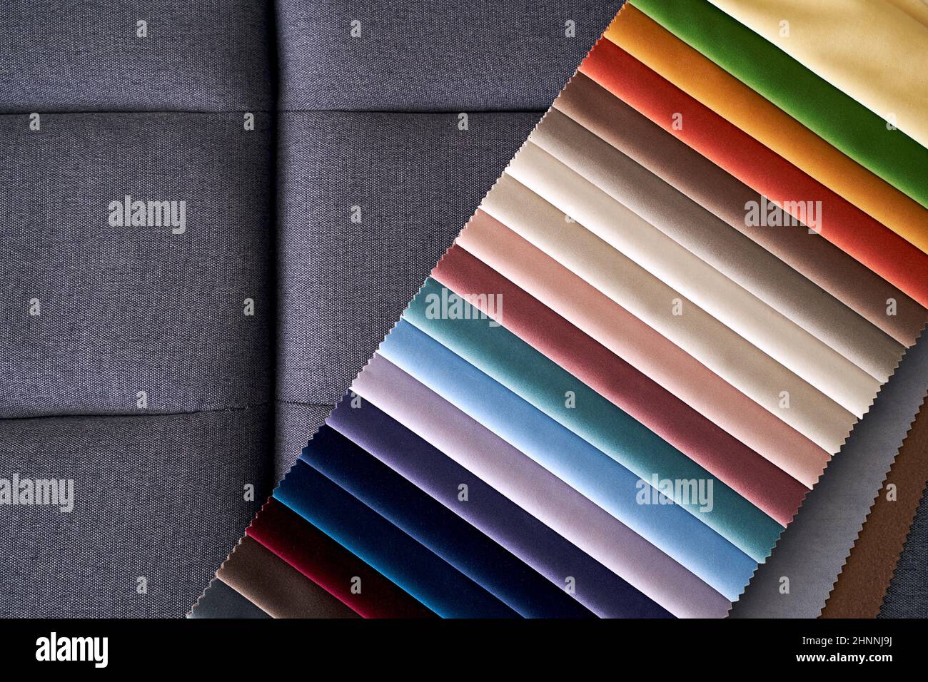 Colorful upholstery fabric samples on the home sofa Stock Photo