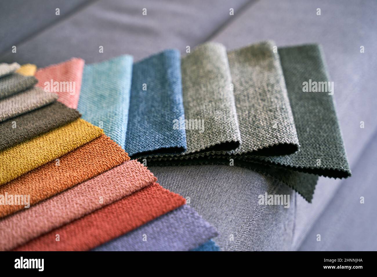 Colorful upholstery fabric samples on the home sofa Stock Photo Alamy