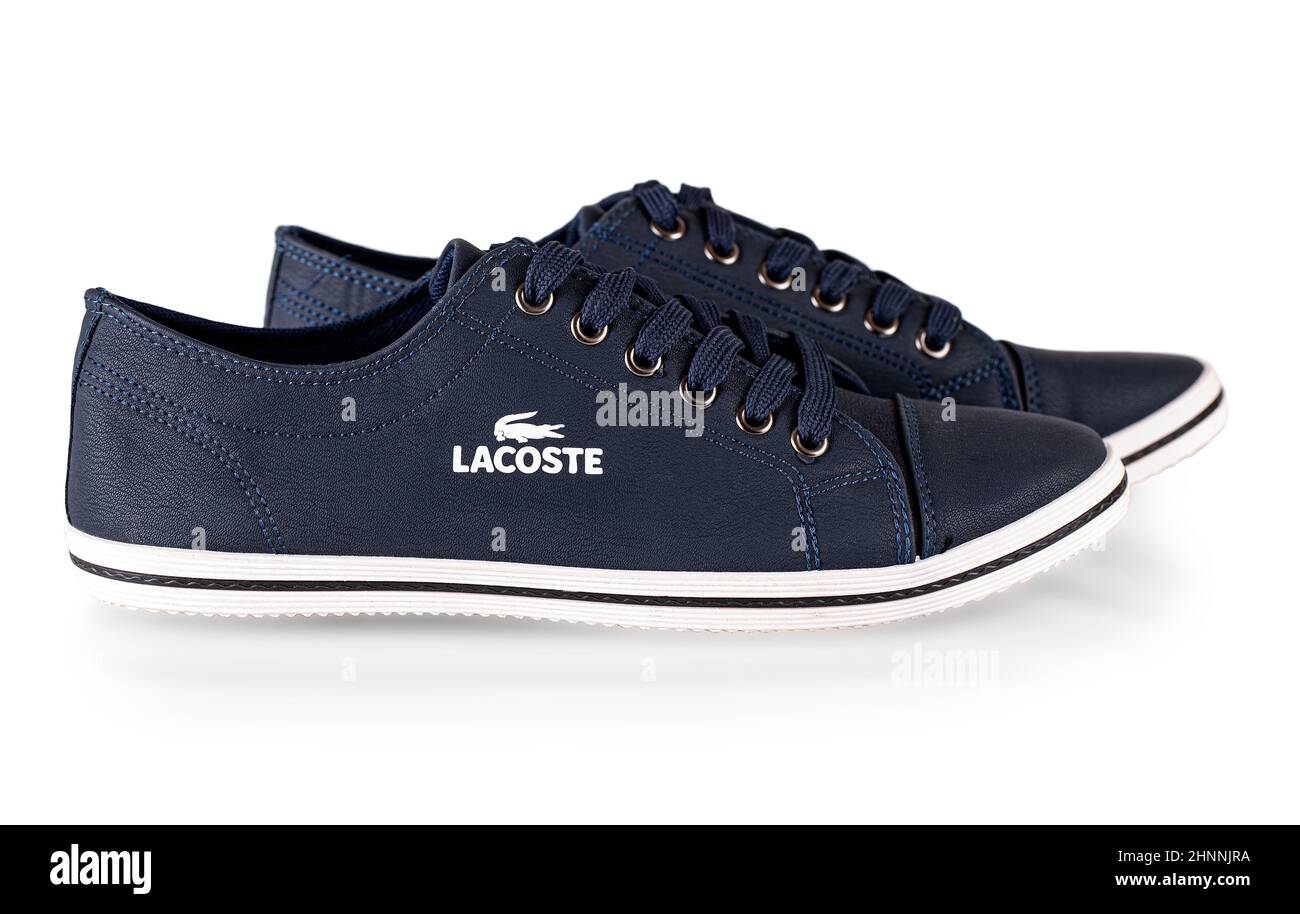 The lacoste blue comfortable shoes for man isolated on white background. Stock Photo