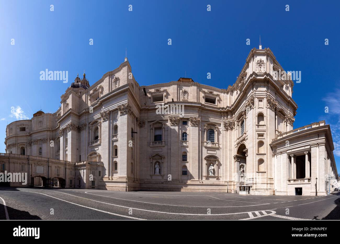 St. Peter's square with the vatican buildings arranged by Michelangelo without people. Stock Photo