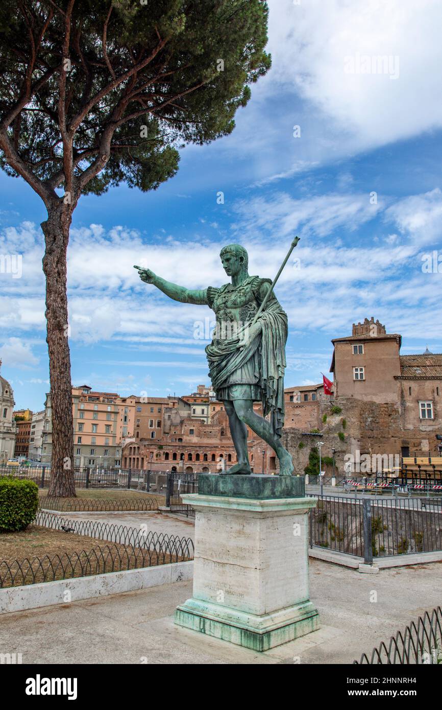Statue S.P.Q.R. IMP CAESARI NERVAE F TRAIANO OPTIMO PRINCIPI on street Via dei Fori Imperiali, Rome, Italy Stock Photo