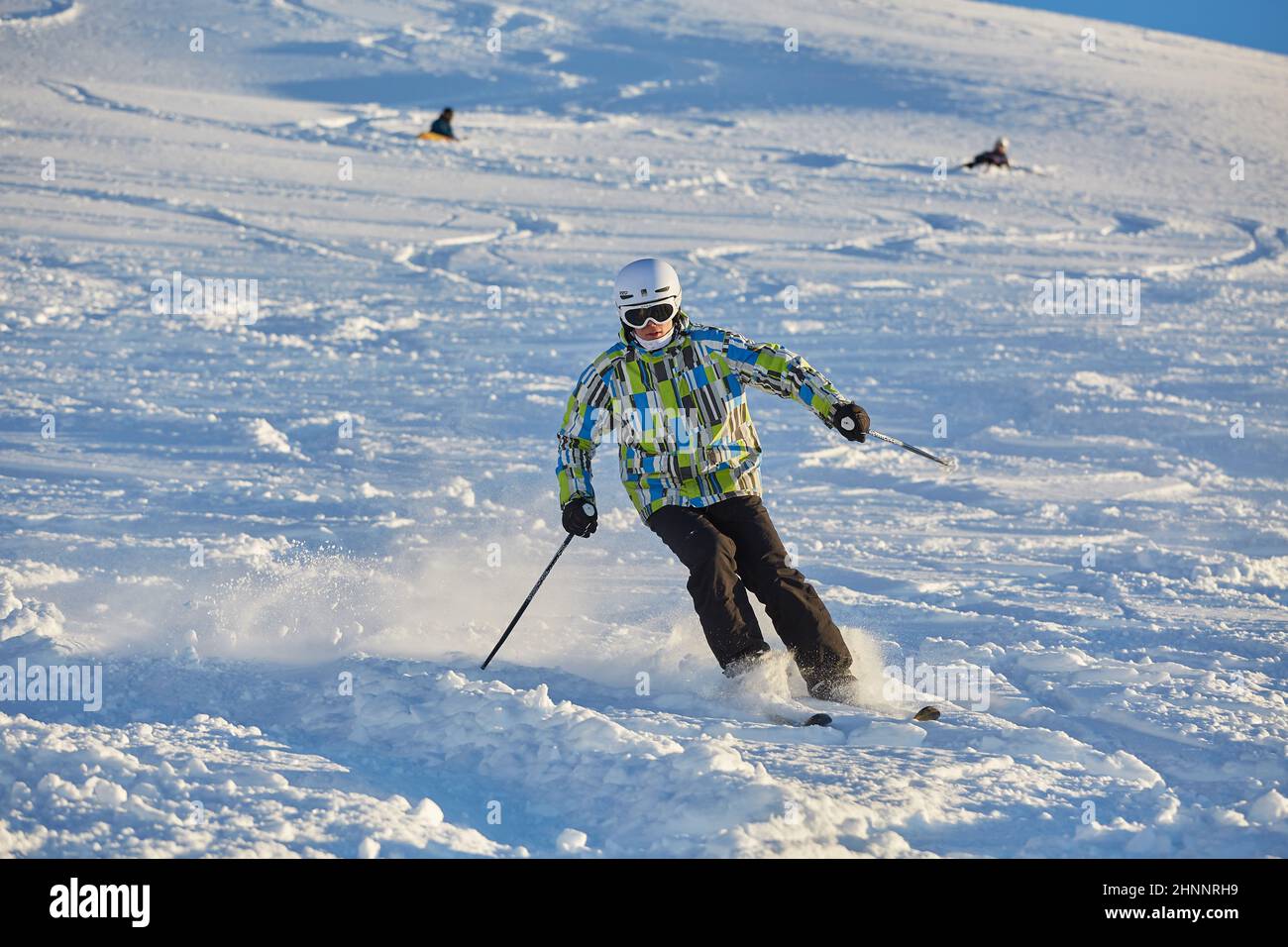 Freeride skier doing hand stand on the peak Stock Photo