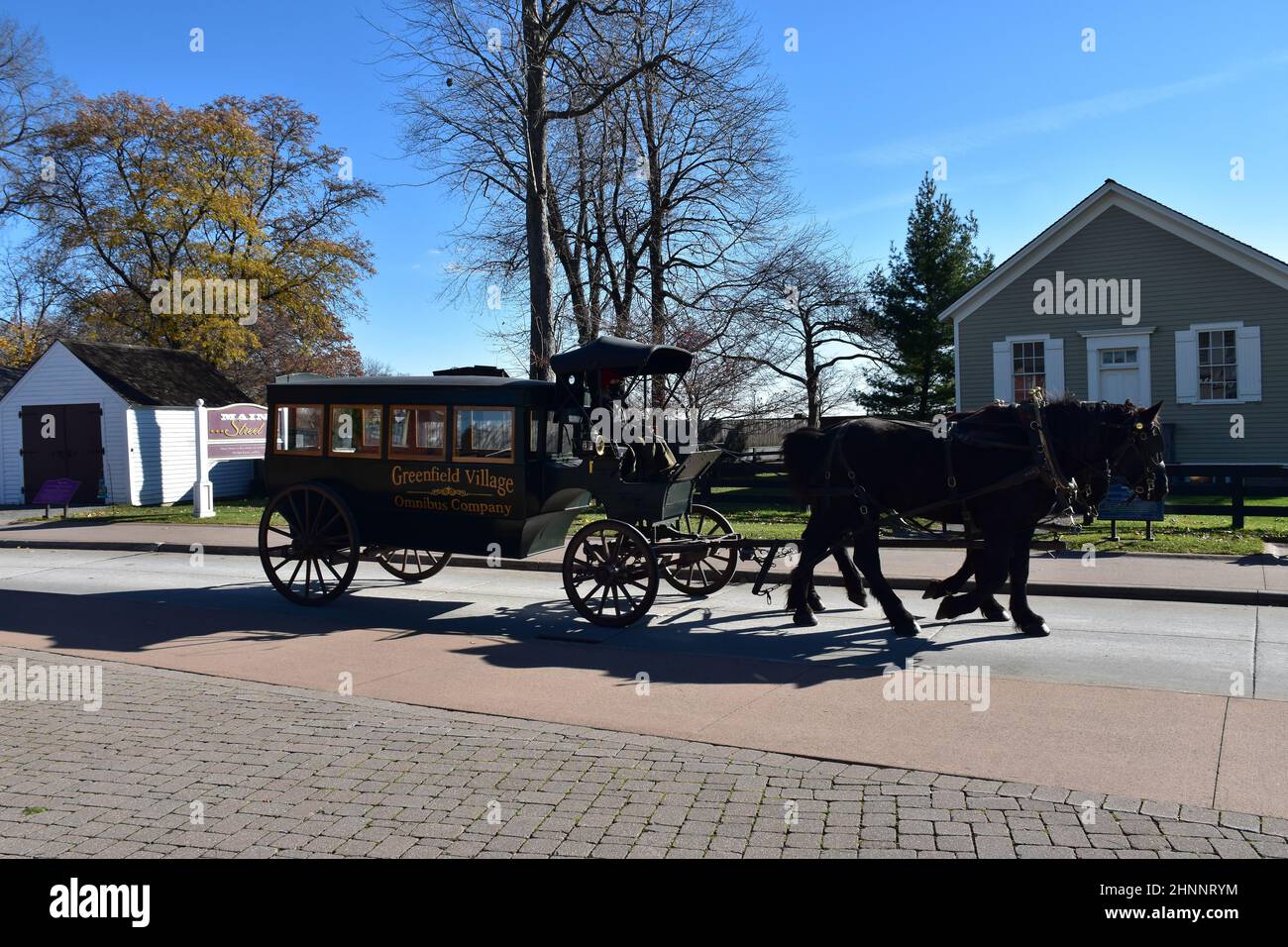 A horse and carriage at Greenfield Village, an 80-acre open air site & part of the Henry Ford museum complex in Dearborn, Detroit, Michigan, USA. Stock Photo