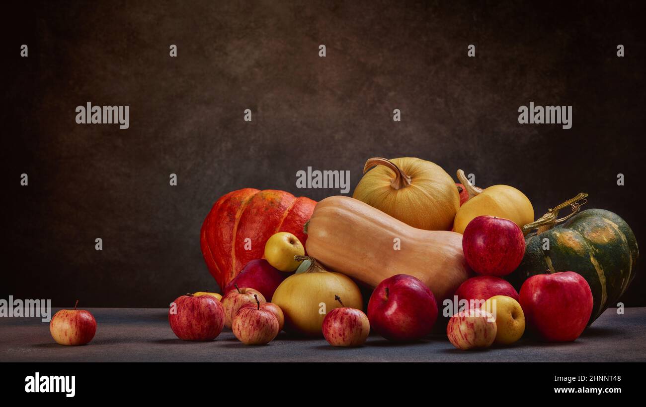 Thanksgiving background. Festive still life with pumpkins and apples on ...