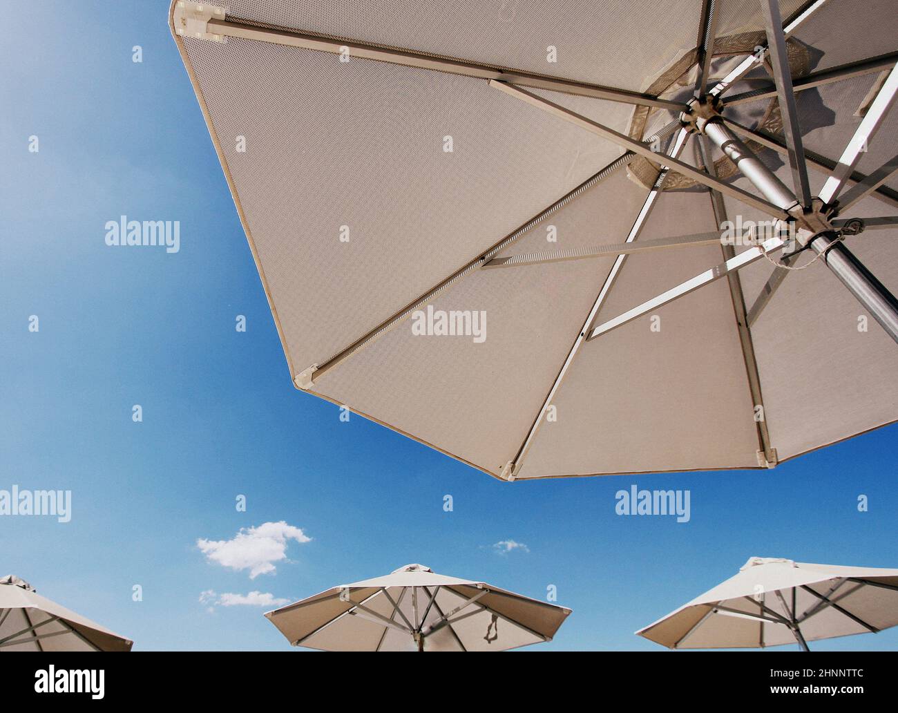 Bright sun umbrellas on the beach Stock Photo