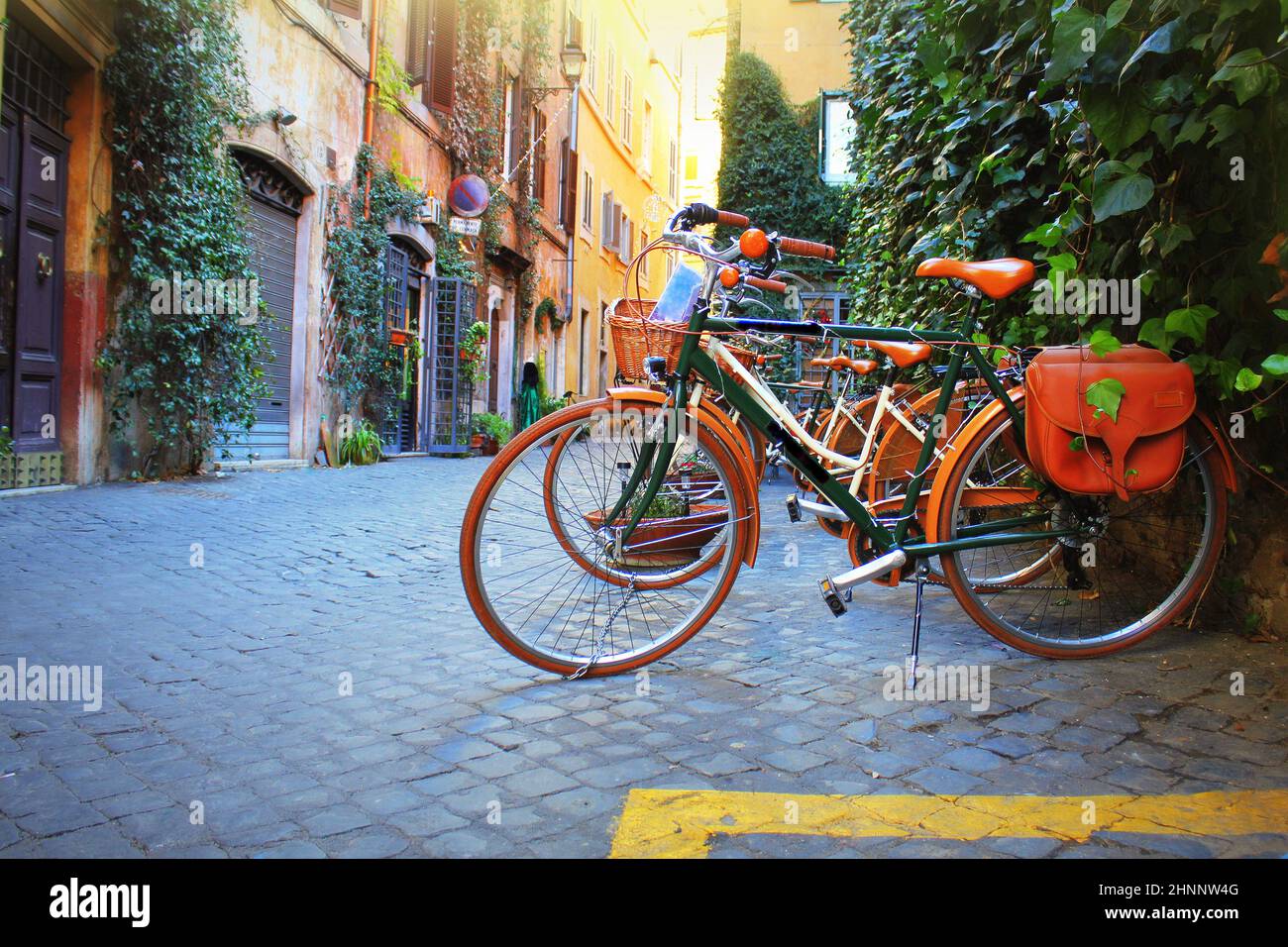 Bicycle standing in front of store on old street of Rome . Stock Photo