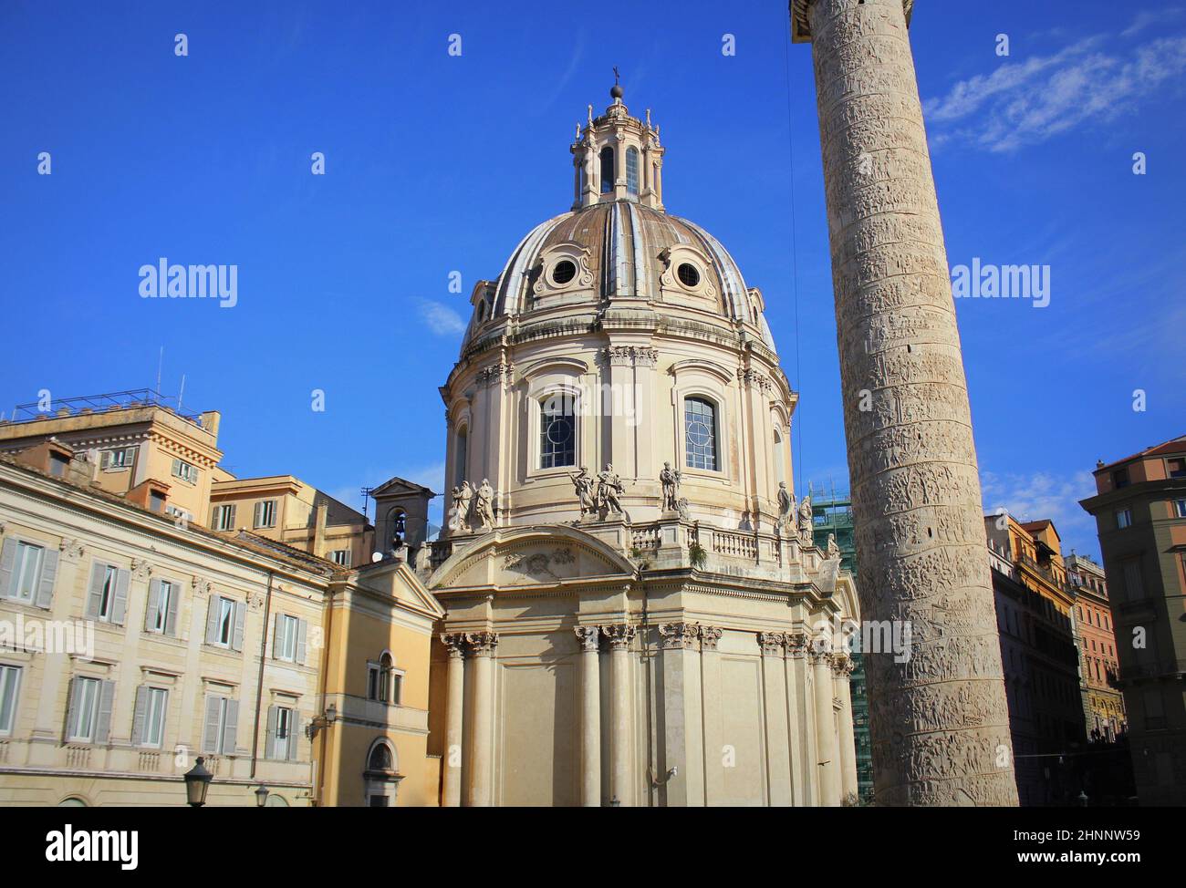 Church of the Most Holy Name of Mary at the Trajan Forum and the Trajan's Column in Rome, Italy. Chiesa del Santissimo Nome di Maria al Foro Traiano. Colonna Traiana Stock Photo