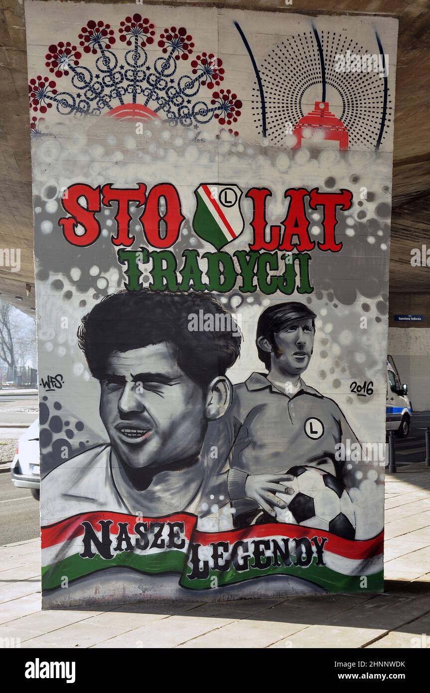 mural of the players of the Legia football club on the pillar of the bridge Stock Photo