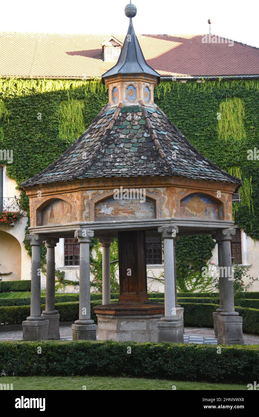 An octagonal structure was erected over the marble basin from 1508 in 1669. The miracle fountain is located in the courtyard of the Neustift monastery in the municipality of Trentino - South Tyrol,Italy. Stock Photo