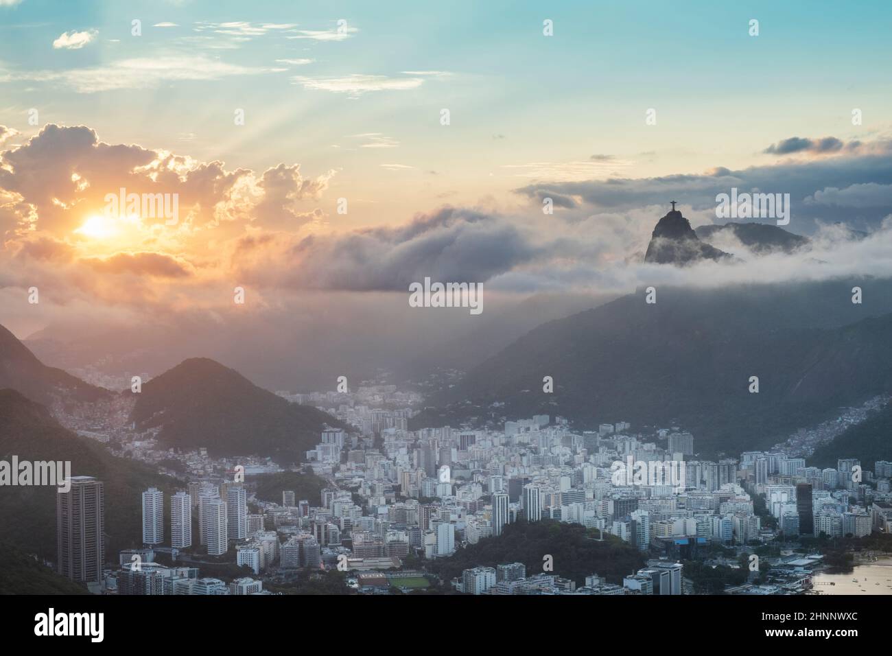 Brazil, Rio de Janeiro. Urban skyline, Botafogo neighborhood, apartments & commercial buildings, the Christ statue on Corcovado, the mountains & sea. Stock Photo