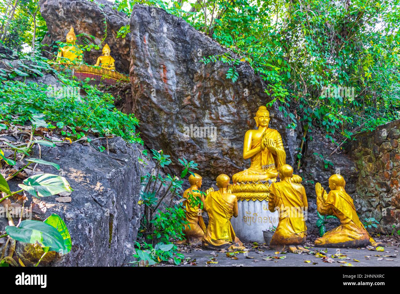 Golden buddha statues Phousi Hill Wat Chom Si Luang Prabang. Stock Photo