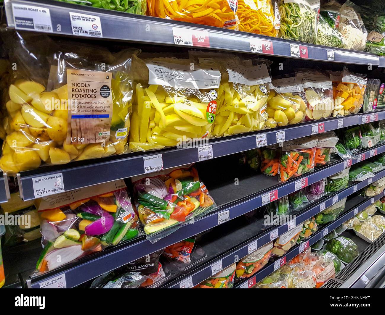 Packaged goods fruits and vegetables on a shelf in supermarket Stock