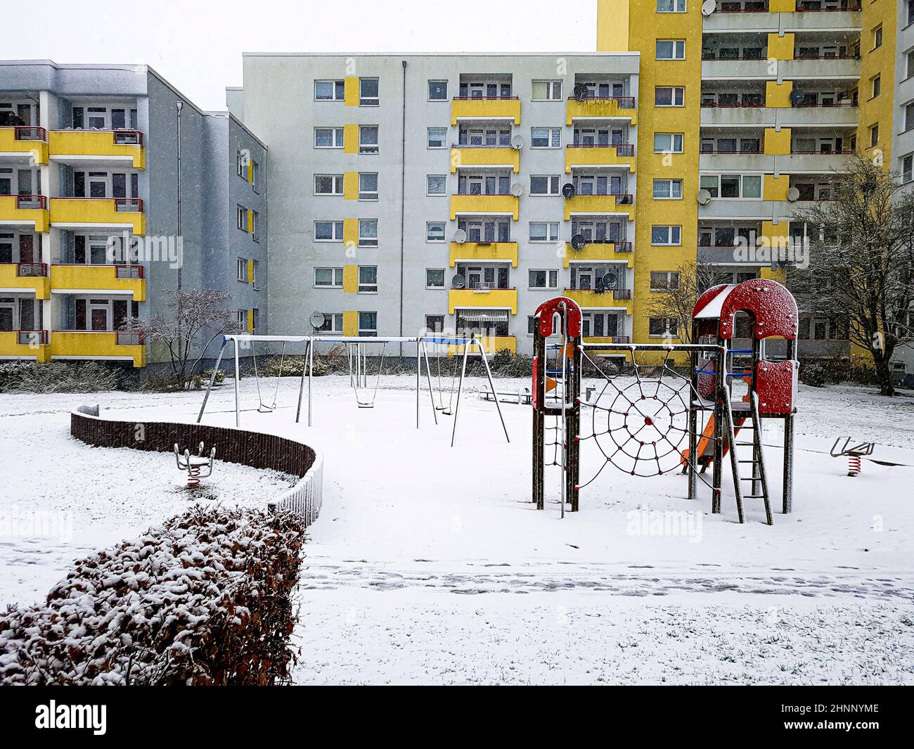 Playground with white snow in winter time in Leherheide, Bremerhaven. Stock Photo