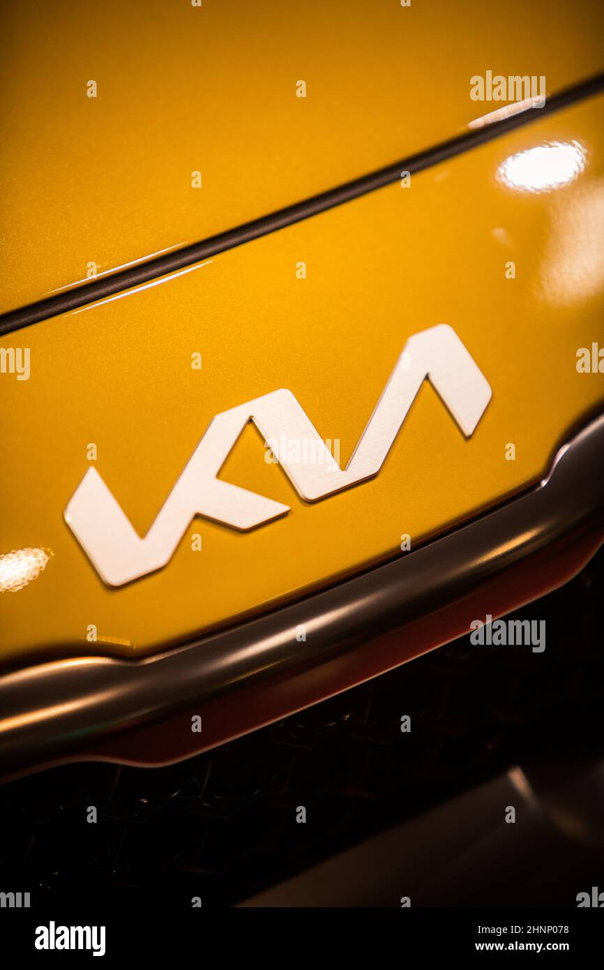 Kia Motors logo on a new car's hood Stock Photo