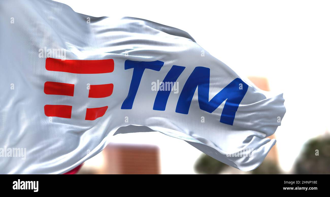 white flag with the TIM logo waving in the wind Stock Photo
