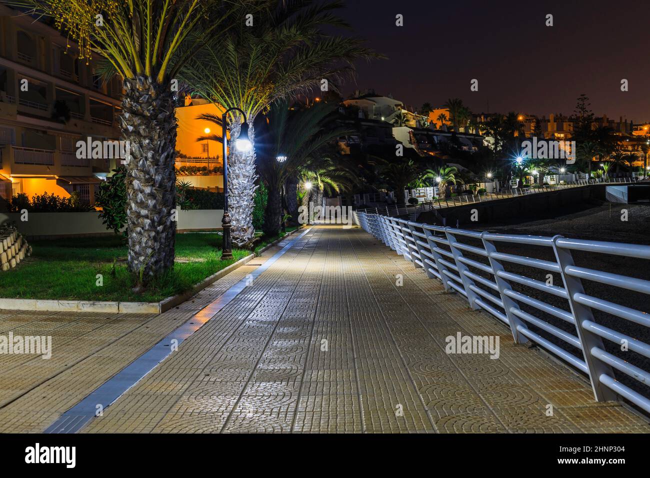 seafront near holiday villas and walkway promenade in Alicante, Spain Stock Photo