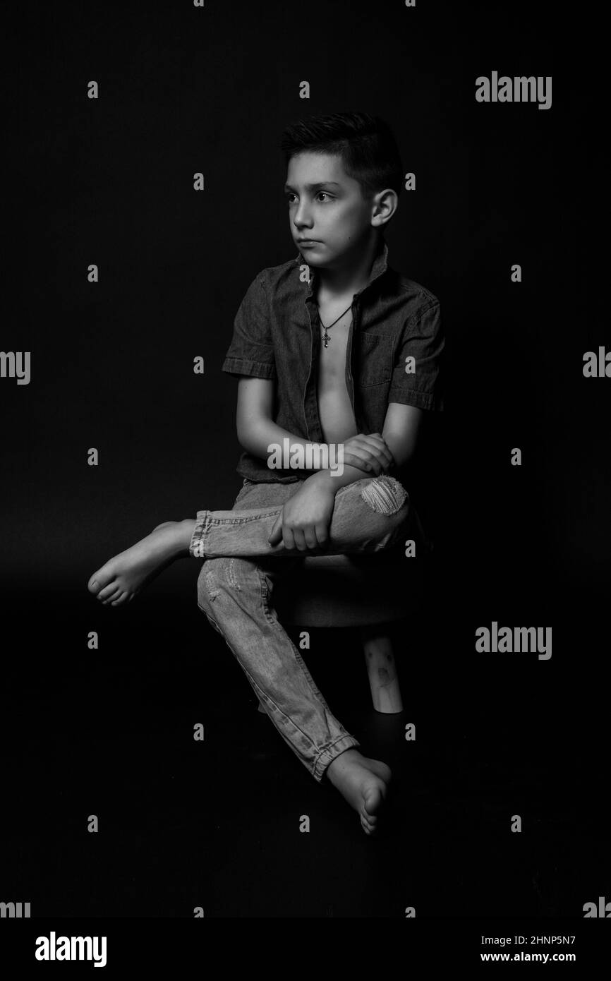 boy posing on a black background. model . close-up Stock Photo