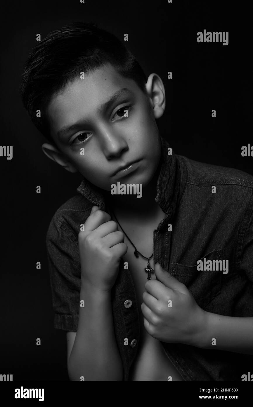 boy posing on a black background. model . close-up Stock Photo