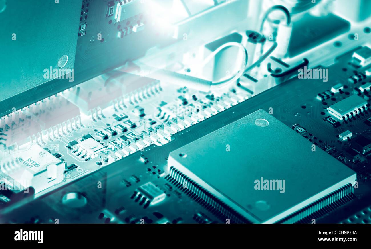 Electronic circuit board. Mainboard of computer. Computer integrated circuit board. Detail of electronic circuit board. Memory of digital information hardware. Electronic engineering technology. Stock Photo