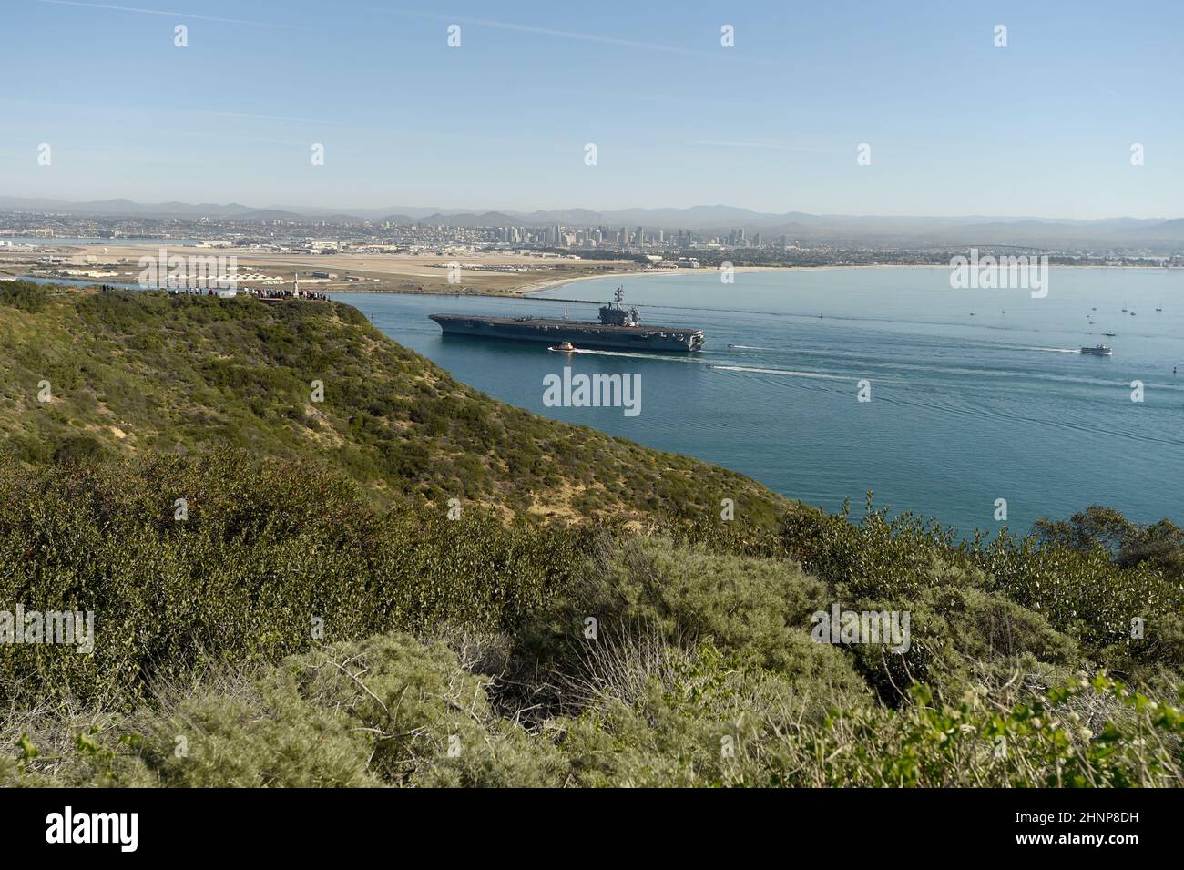 USS Carl Vinson (CVN 70) returns home after an eight month deployment. Cabrillo National Monument in foreground, NAS North Island in background. Stock Photo