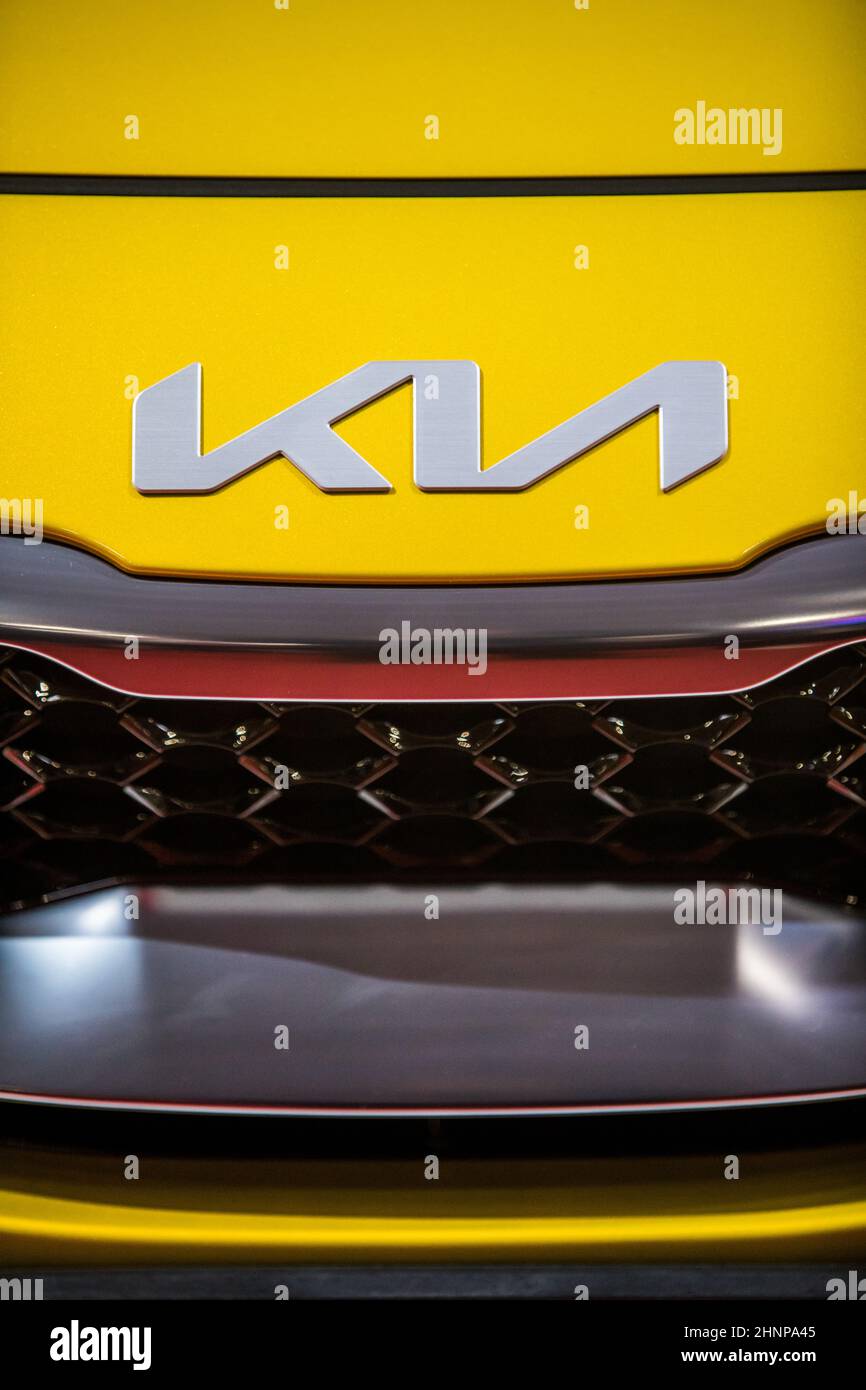 Kia Motors logo on a new car's hood Stock Photo