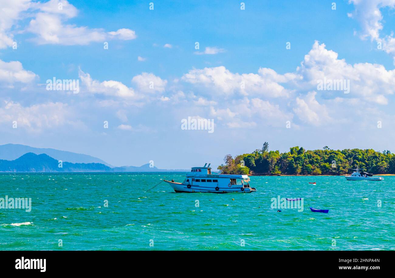 Ferry boats at Tai Kak Pier tropical sea Ranong Thailand. Stock Photo